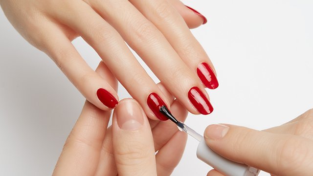 application of  essie top coat nail polish for long-lasting shine and nail care